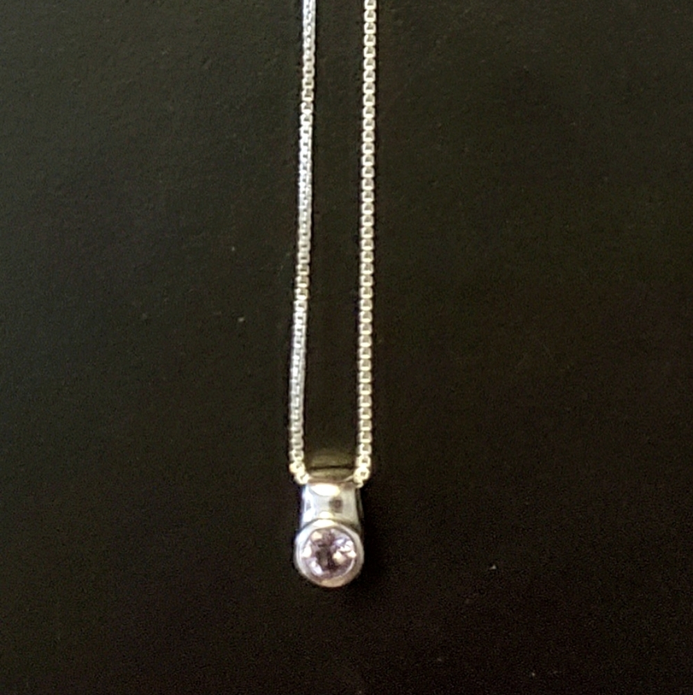 Beautiful silver necklace with purple pendant